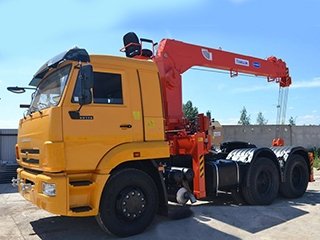 Седельный тягач КАМАЗ-65116 с КМУ Kanglim 1256